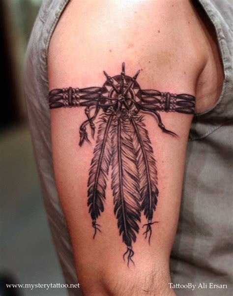 A howling, running, or snarling wolf would look particularly striking in the tribal style. . Cherokee native american armband tattoo